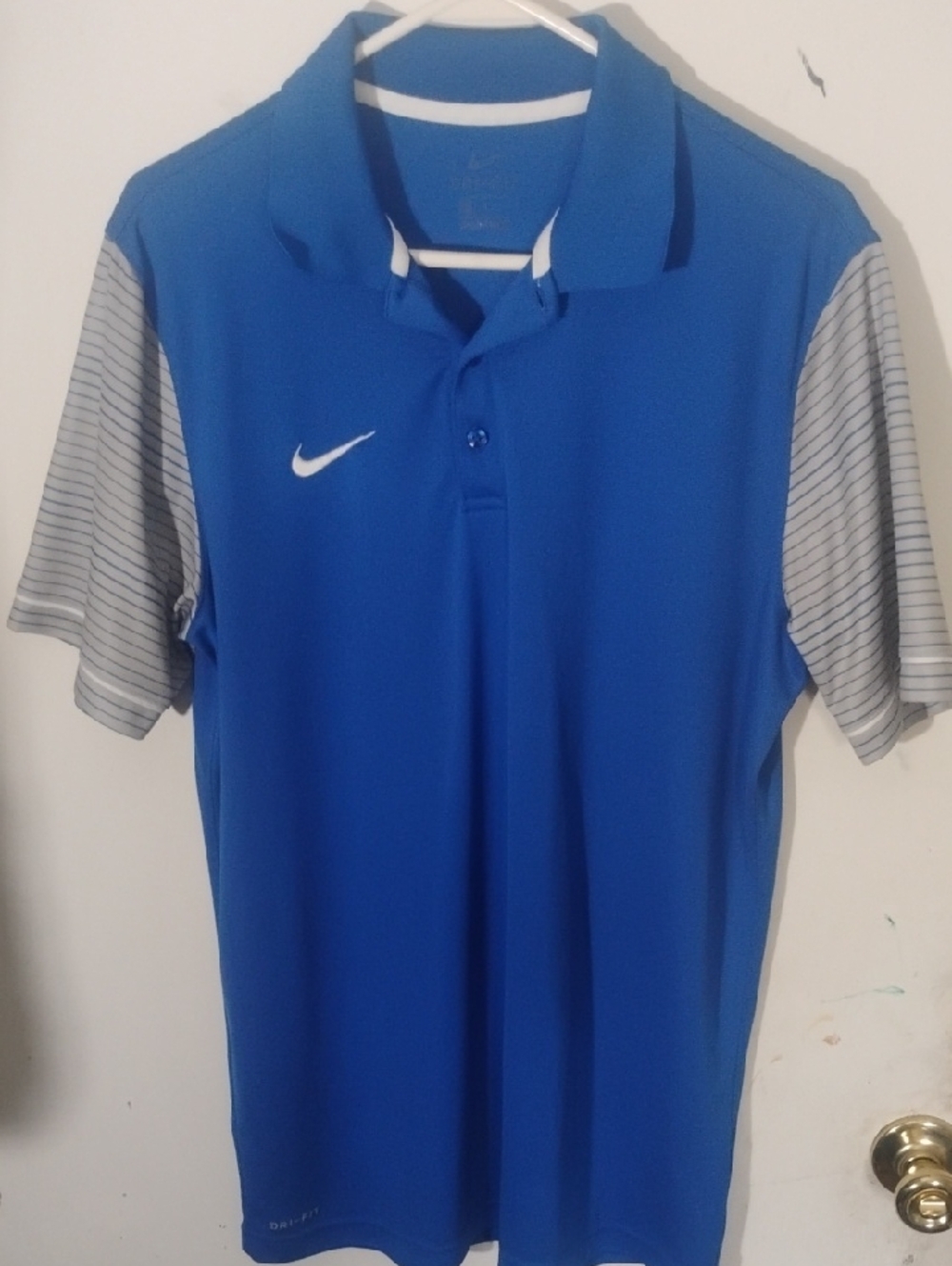 Nike Men’s Blue Polo Shirt with Gray Striped Sleeves